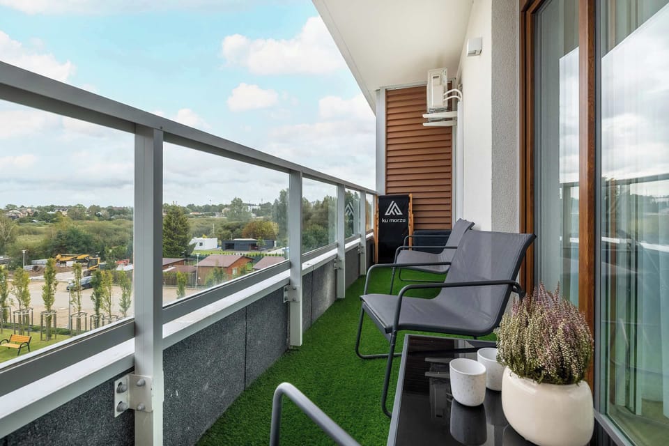 The balcony provides a perfect spot for enjoying the fresh air.