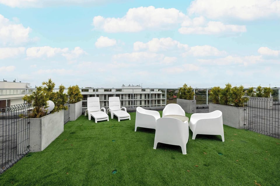 Terrace in the common area offers garden furniture.