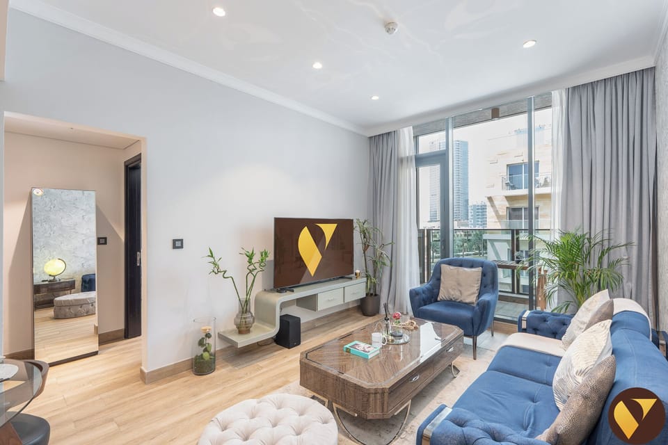 Luxury Apartment, Balcony, City View | Living area | 65-inch Smart TV with satellite channels