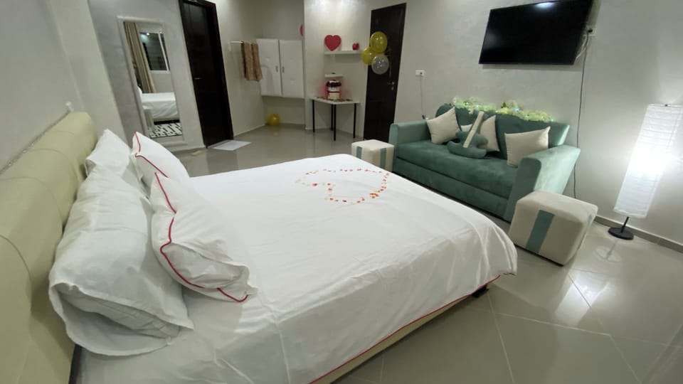 Comfort Suite, Balcony, Pool View | Desk, laptop workspace, iron/ironing board, free WiFi