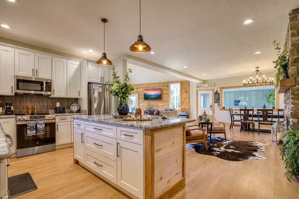 Create meals in a gourmet kitchen with leathered granite counters, premium appliances, and sophisticated design. — a chef’s dream in the Smokies.