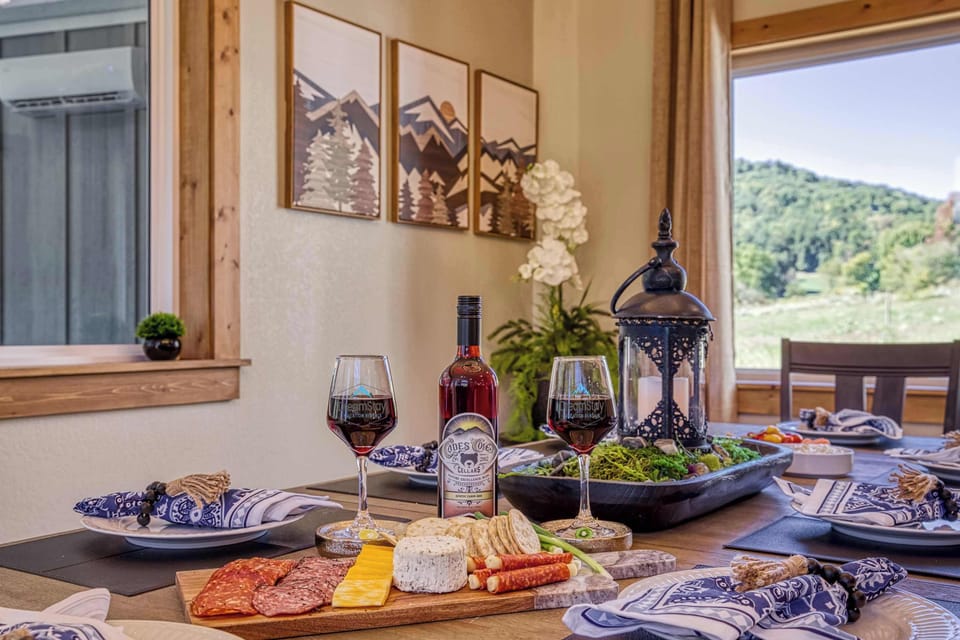Share evenings of wine and conversation in this elegant dining area with warm wood finishes.