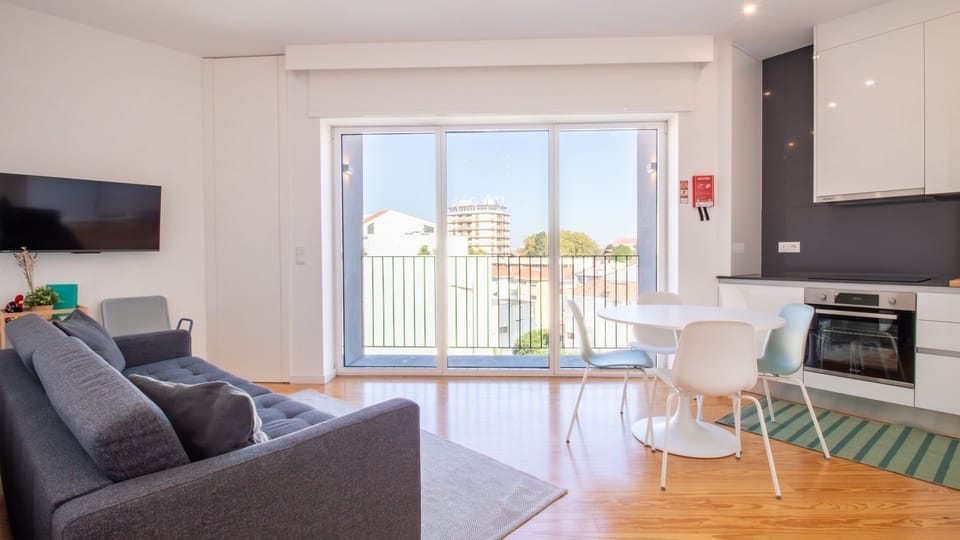 Stylish open-plan living area with a smart TV and dining space.
#ModernLiving #GaiaApartment #DesignStay