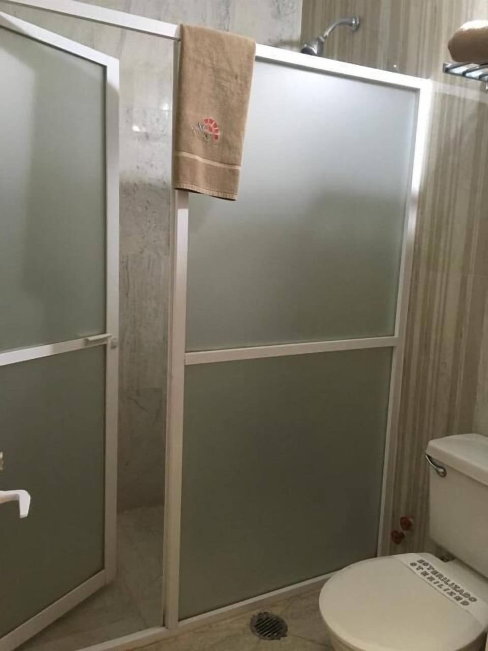Shower, towels, soap, toilet paper