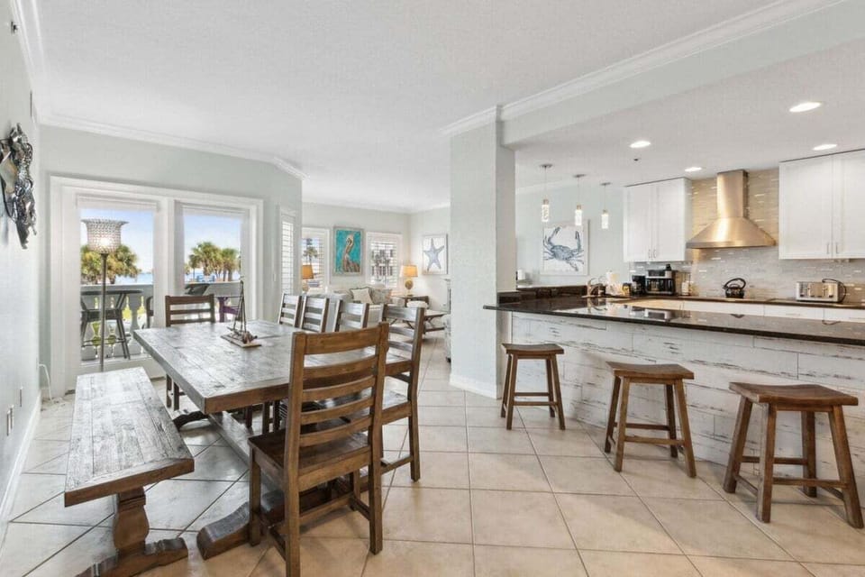 Dine, chat, and gather in the oversized dining space with bar seating