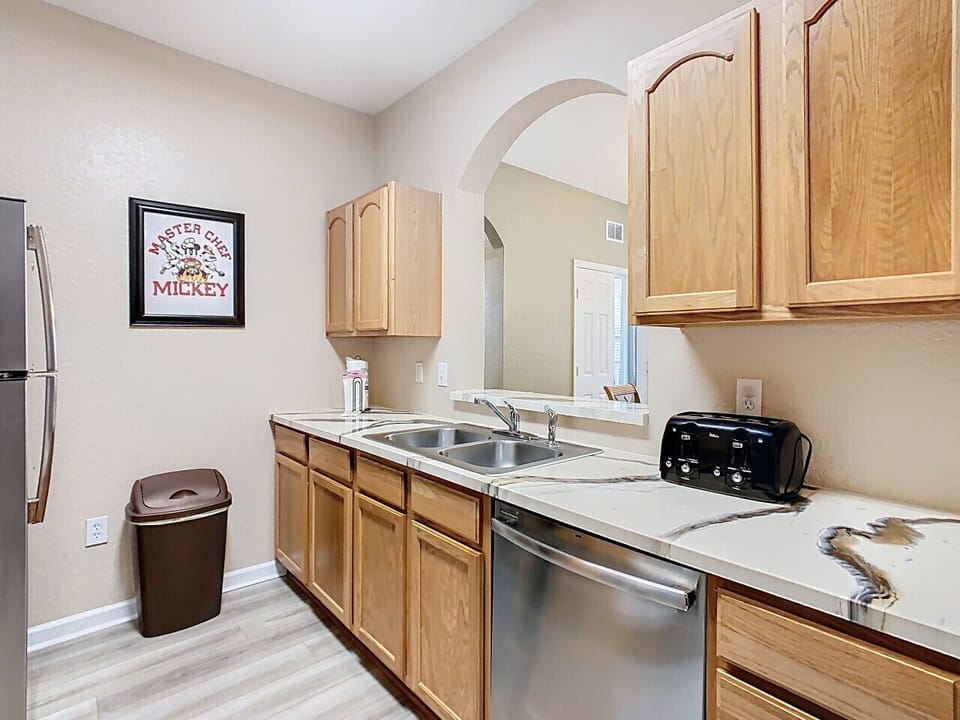 Fully equipped kitchen with modern appliances and plenty of counter space for family meals.