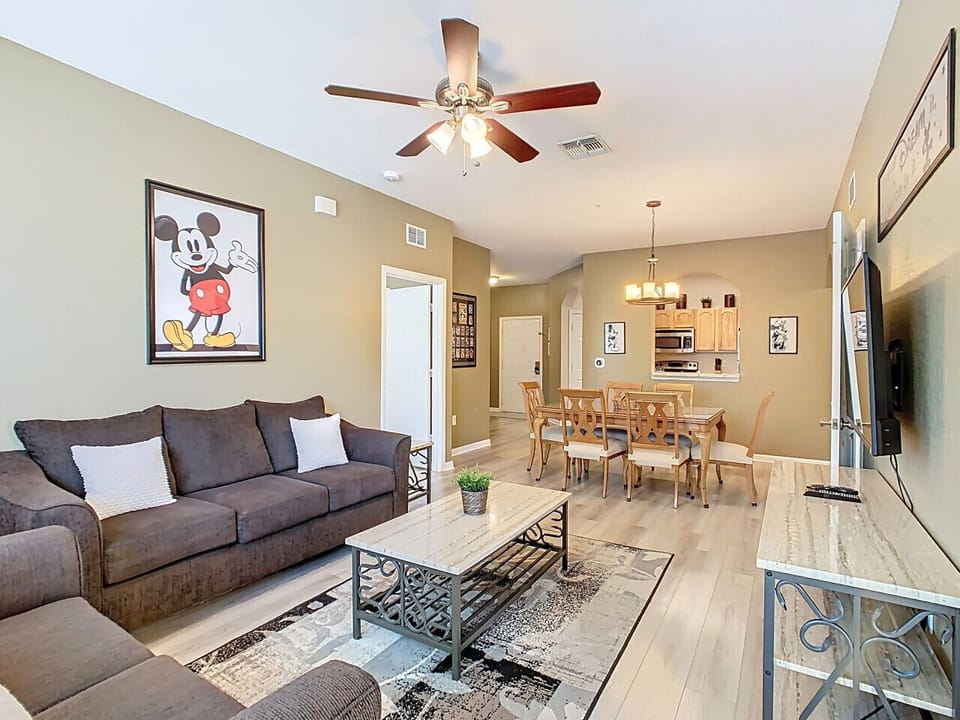 Family-friendly open layout with dining area and comfy living space, featuring playful Disney touches.