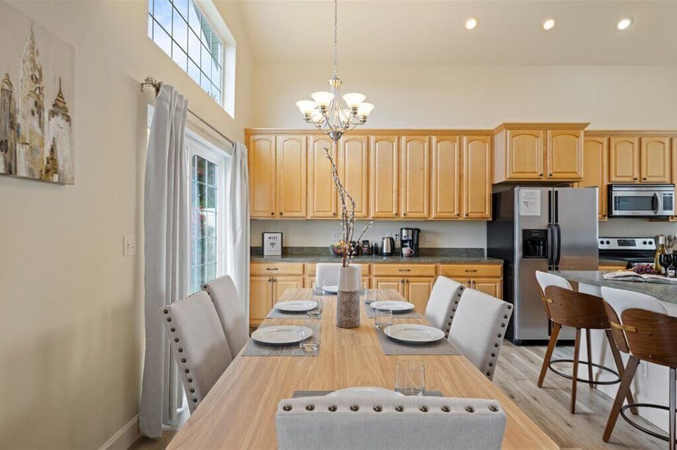 Dining area for six with open flow to kitchen and patio for easy hosting