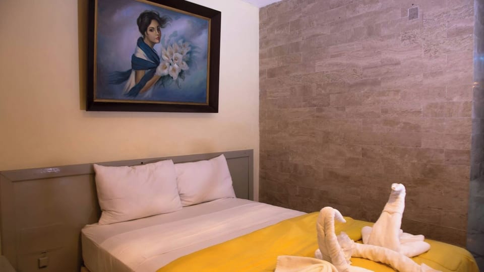Sink into soft pillows beneath warm, soothing wall textures.