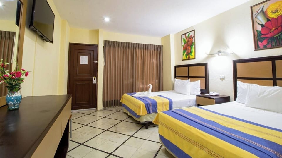 Unwind in a bright twin room with crisp linens.