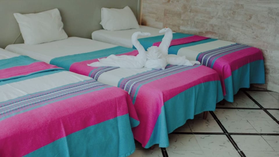 Recharge after adventures in crisp beds with cozy throws.