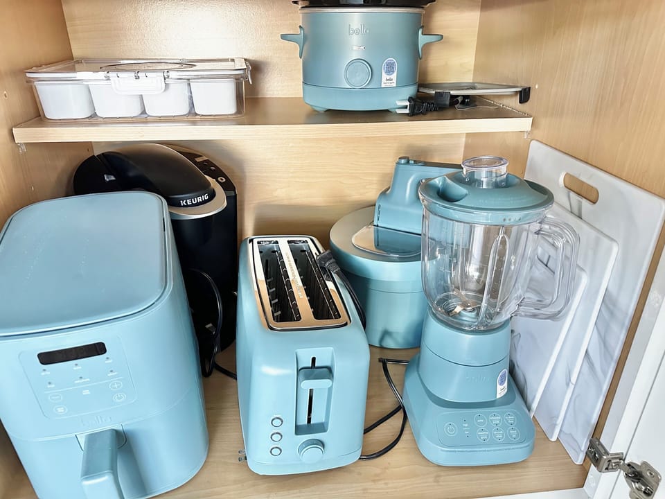 Appliances for your stay, stored in kitchen cabinets.