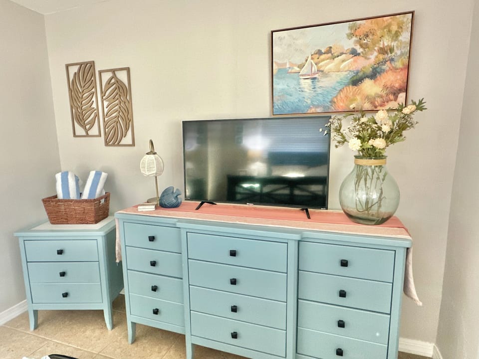 Guest bedroom tv and dresser for storage