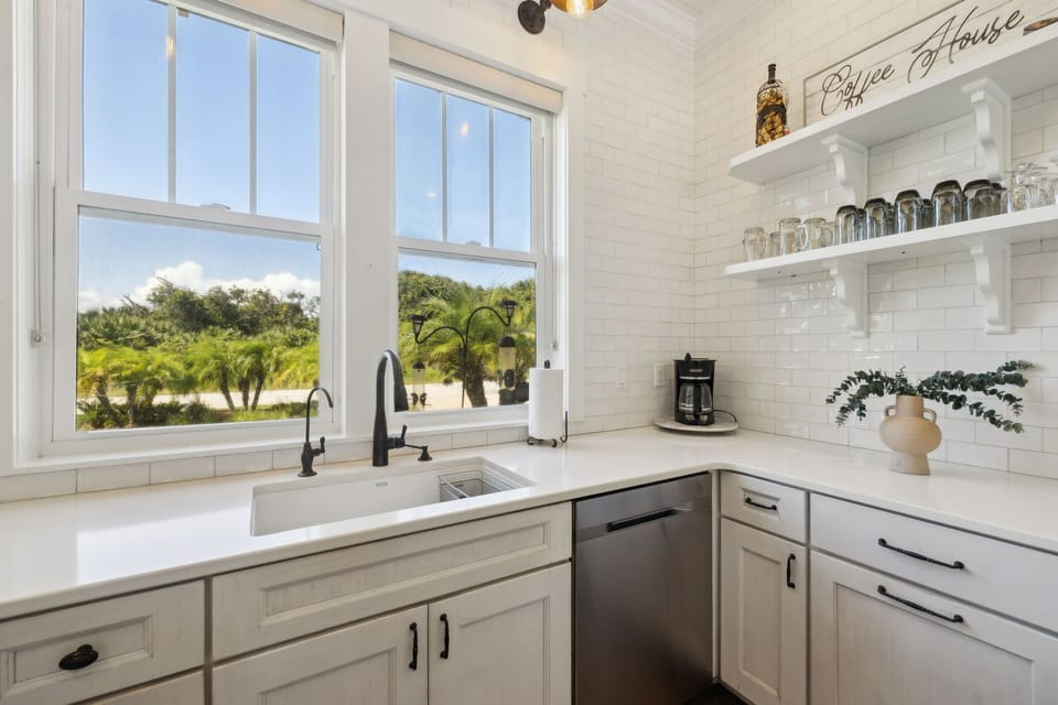 Full kitchen with stainless steel appliances: Gas stove top, oven, refrigerator, microwave, dishwasher, reverse osmosis water system, drip coffee maker, Nespresso machine, toaster, blender, crock pot, and fully stocked with all kitchen essentials.