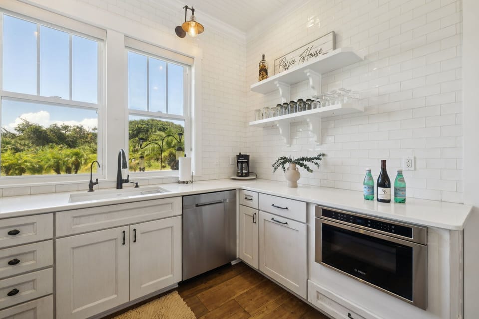 Full kitchen with stainless steel appliances: Gas stove top, oven, refrigerator, microwave, dishwasher, reverse osmosis water system, drip coffee maker, Nespresso machine, toaster, blender, crock pot, and fully stocked with all kitchen essentials.