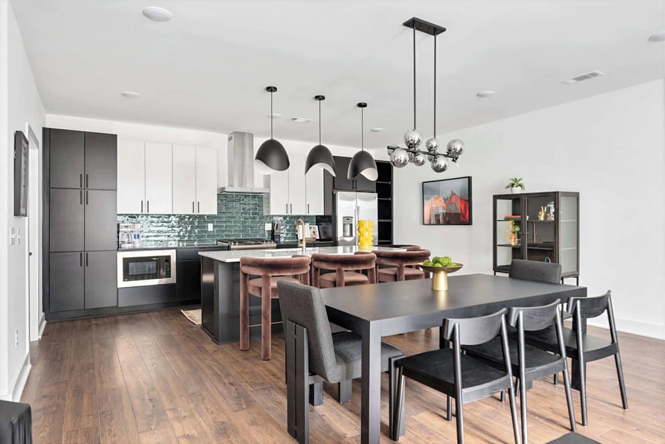 Gather around the kitchen island for cooking together, then move everyone to the bench-seated dining table where no one gets left out of the conversation