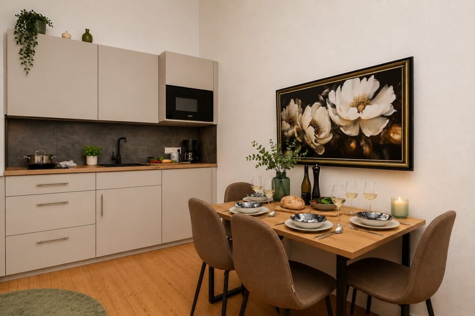 Gather around the dining table and enjoy the convenience of a modern kitchenette with everything you need to prepare meals, snacks, and drinks during your stay.