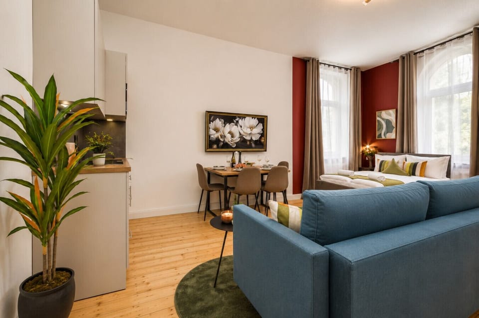 Enjoy the perfect blend of comfort and convenience with a welcoming lounge area, dining space, kitchenette, and comfortable bed, creating a relaxing home-away-from-home experience.