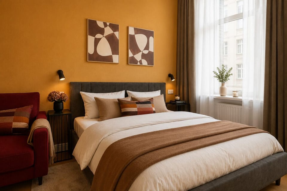 Enjoy a restful retreat in this beautifully designed bedroom space with comfortable bedding, stylish décor, and a bright window-side setting that creates a calm and welcoming atmosphere.