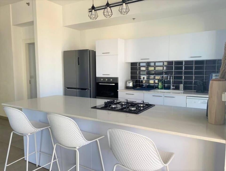 Open-plan dining and living area encourages connection, perfect before heading out to nearby entertainment.