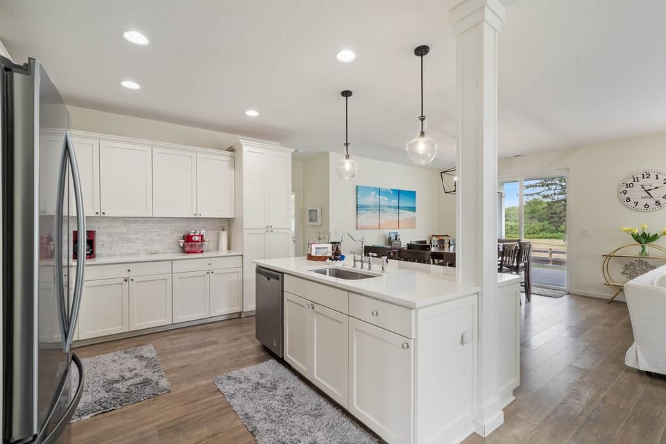 Mingle in the open-concept kitchen, a layout that keeps everyone connected.
