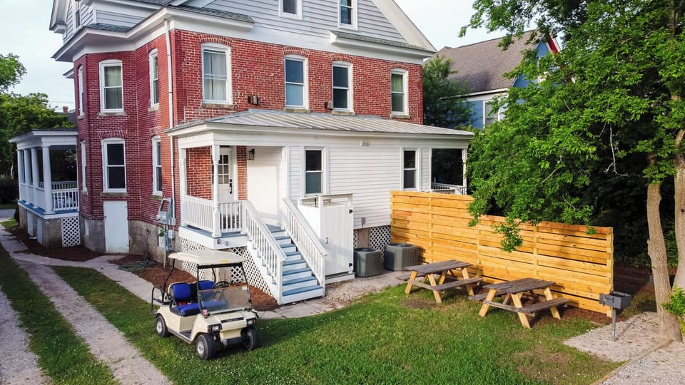 Shared backyard offers additional parking. A BBQ grill and outdoor seating have been recently installed behind the house on each side as well.