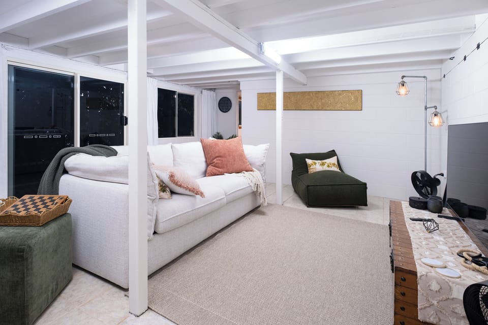 Lounge with Queen couch-to-bed security screens, fans & TV