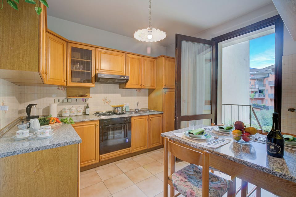 Family Apartment, Multiple Bedrooms, 2 Bathrooms (Lake Garda Home) | Private kitchen | Fridge, oven, stovetop, coffee/tea maker