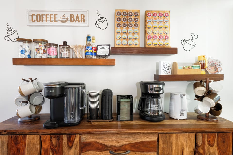 Savor your morning coffee or tea from our fully stocked coffee bar, thoughtfully curated with everything you need and more.