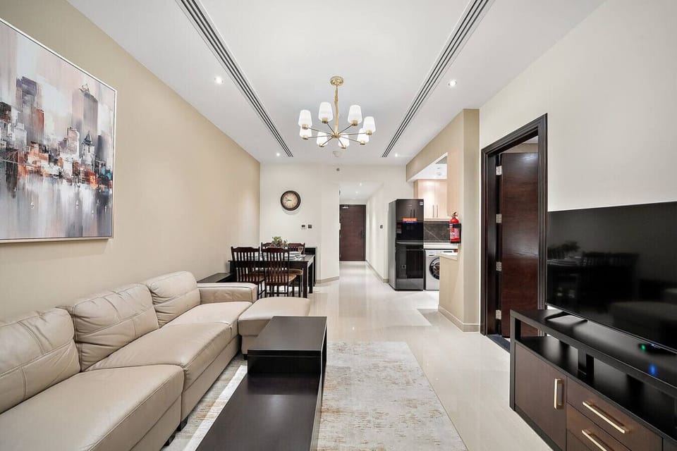Spacious layout connecting living, dining, and kitchen in one modern zone.