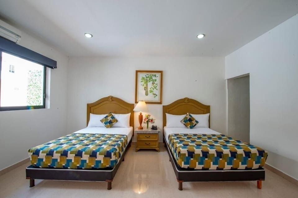 Unwind in bright twin beds with crisp linens and AC.
