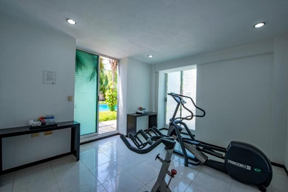 Keep your routine going in a bright, convenient fitness room.