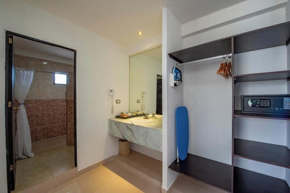 Freshen up easily with vanity area, safe, and open storage.