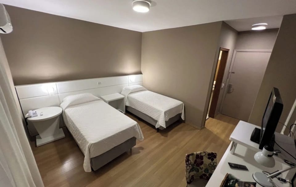 Relax in quiet comfort with bedside lighting and tidy finishes.