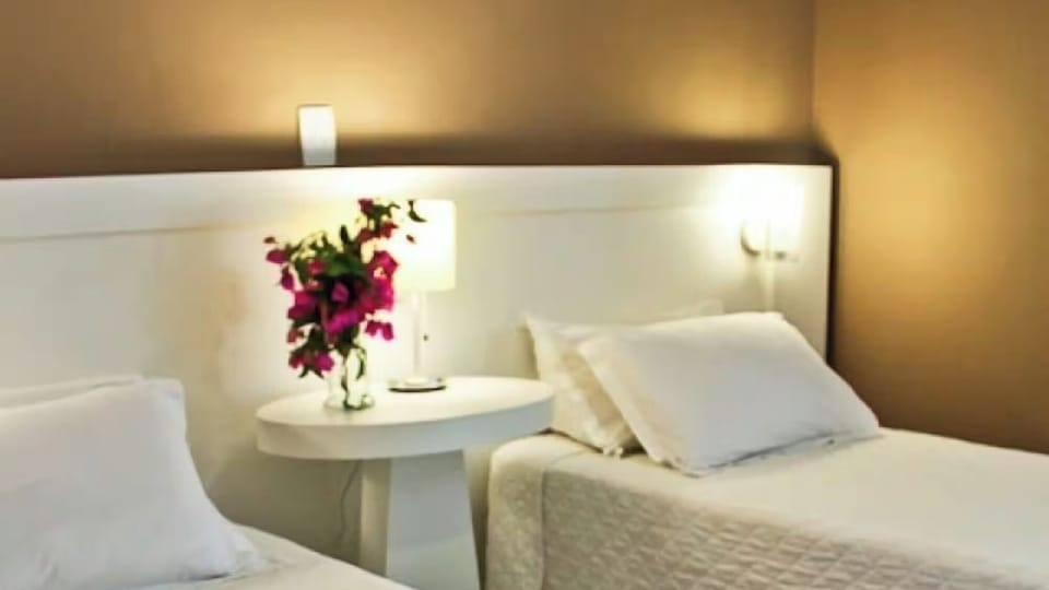 Sink into freshly made beds under warm, soothing bedside lights.