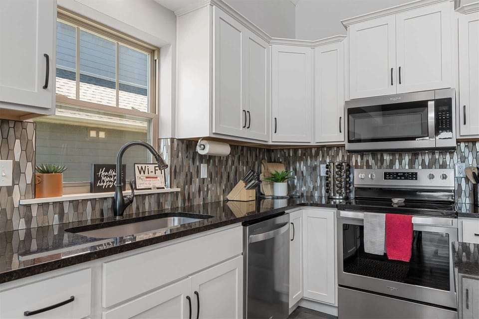 The open kitchen offers ample space & all the comforts of home​