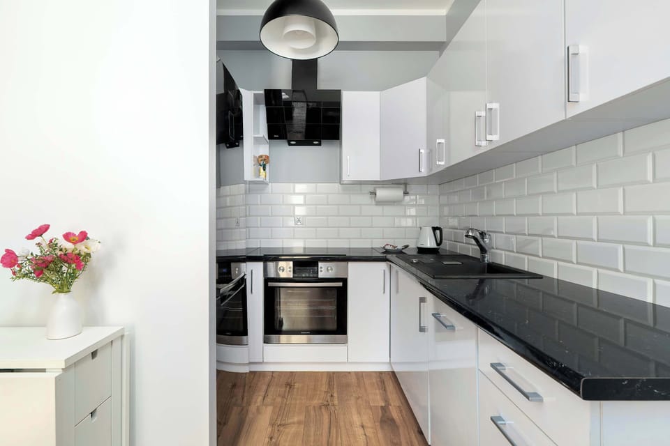 Bright kitchen with cooking utensils. 