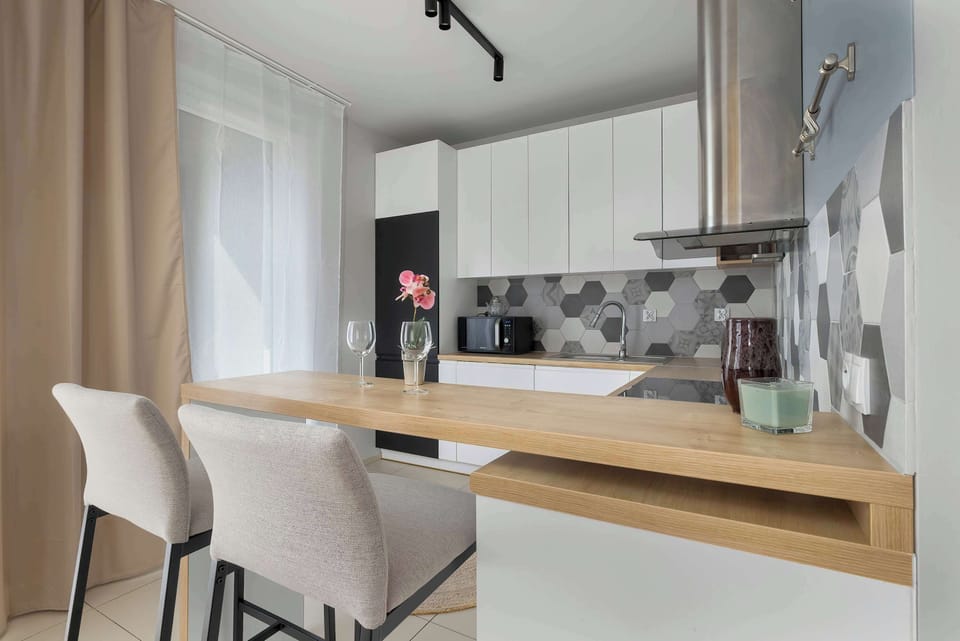 Bright kitchen with cooking utensils. 