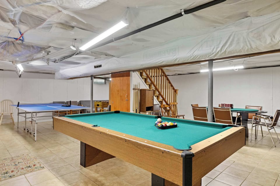 Basement game room with pool table for family fun