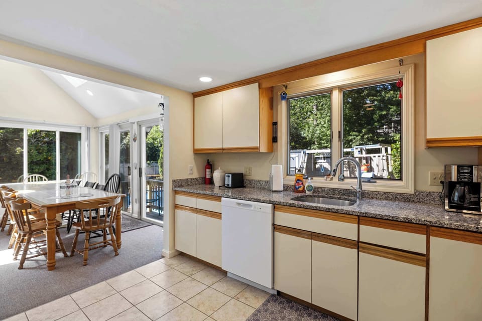 Open kitchen and dining area with direct access to the patio