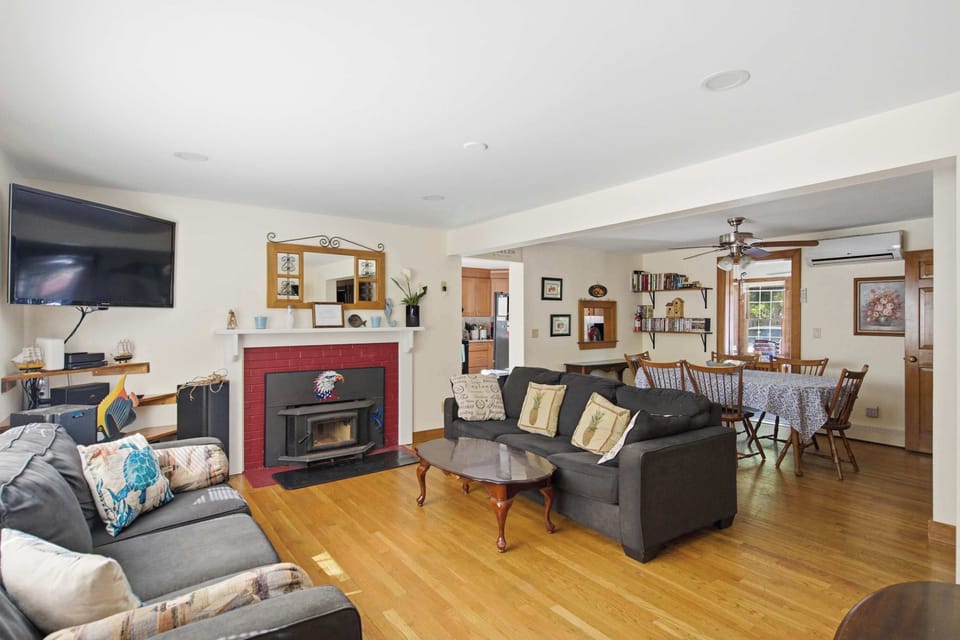 Bright living room filled with natural light and comfortable seating.