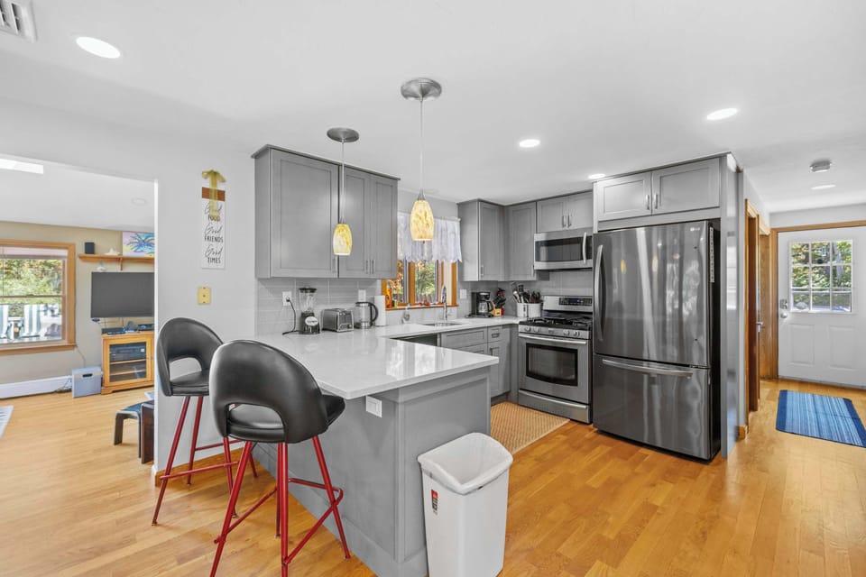Modern fully equipped kitchen with stainless steel appliances