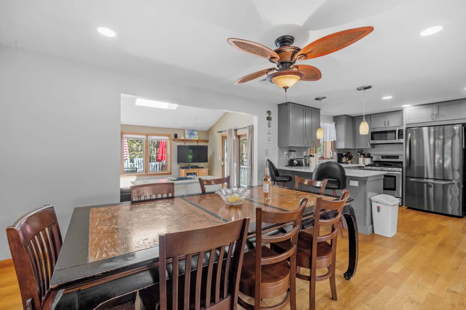 Open concept layout connecting kitchen, dining, and living spaces