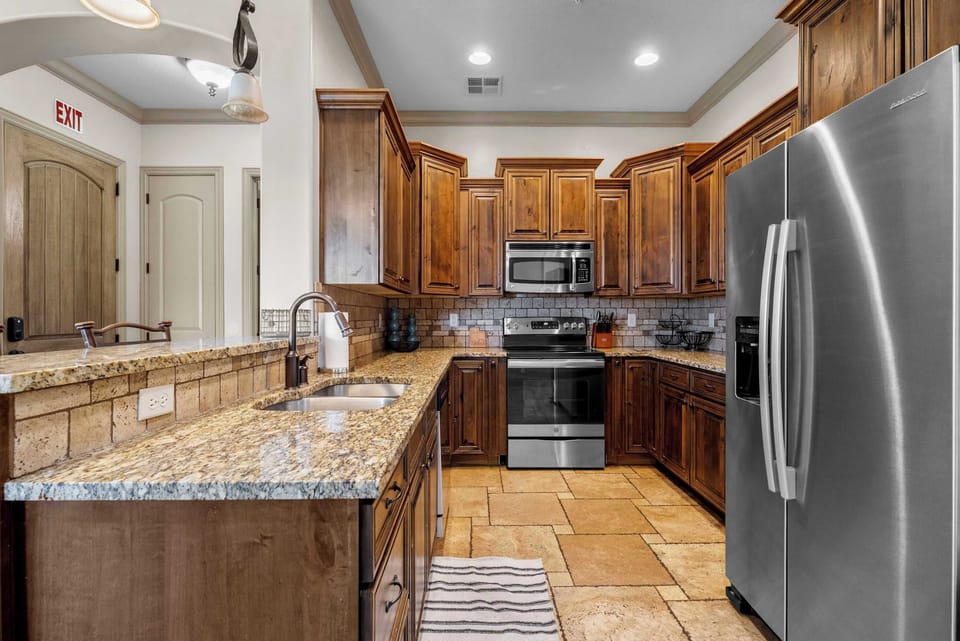 The open kitchen offers ample space & all the comforts of home​