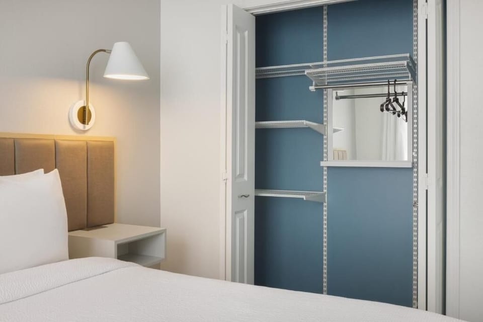 Stow luggage easily with open shelving and hanging space.