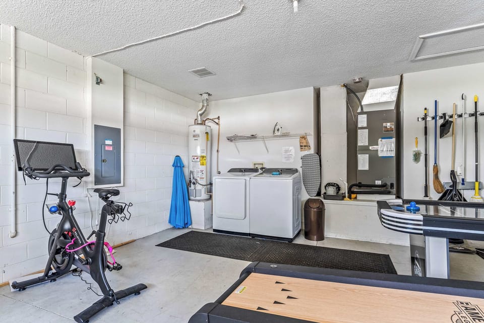 Garage with laundry, Peloton bike, air hockey, and more!
