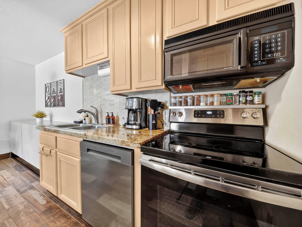 Fully equipped galley kitchen with brand-new appliances and plenty of storage, perfect for cooking during your mountain stay