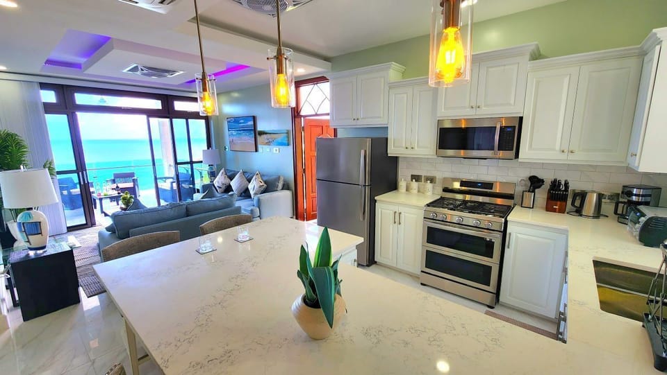 Villa, Ocean View | Living area | 50-inch flat-screen TV with cable channels