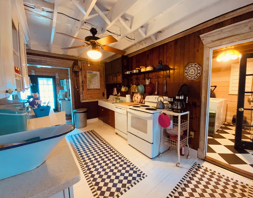 Fully stocked kitchen with toaster oven and drip and espresso coffee makers.