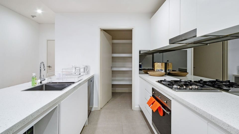 Spacious kitchen featuring ample storage and pantry.